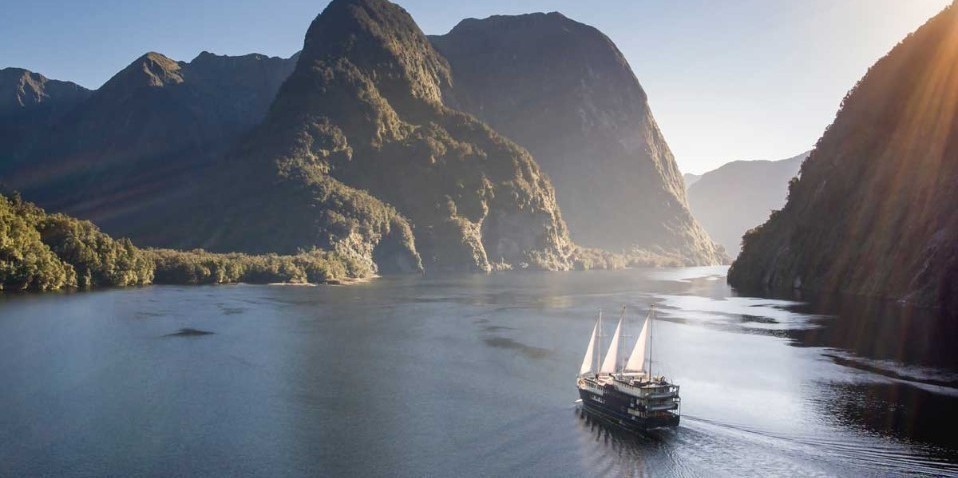 RealNZ Overnight Cruise boat surrounded by Doubtful sound scenery