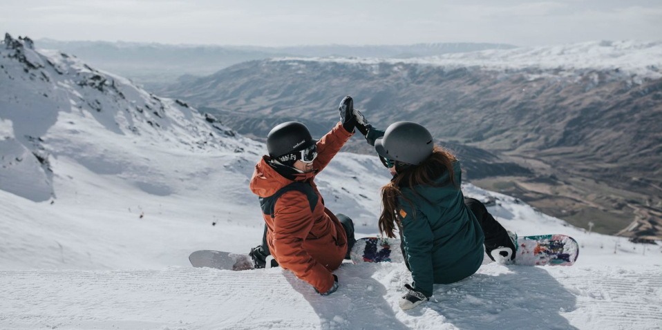 Couple enjoying the snow at Cardrona Alpine Resort Queenstown